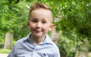 Mel Hudson Family Photography Belfast, colour portrait of a little boy smiling
