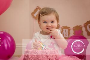 cake smash photography session at home in Hillsborough, Belfast, with pink icing